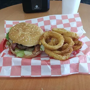 a hamburger and onion rings