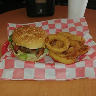 a hamburger and onion rings