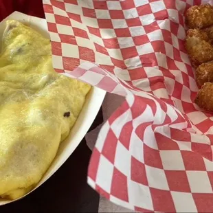 Meat lovers omelette with tots.