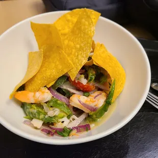 a plate of food with a tortilla
