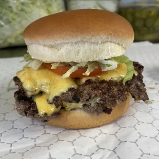a hamburger with cheese and lettuce
