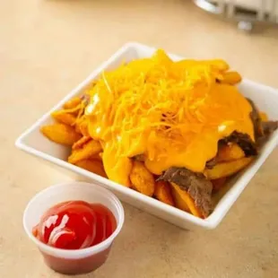 a bowl of fries and ketchup