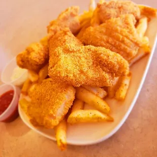 a plate of fried chicken and french fries