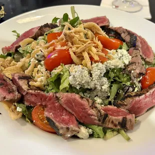 KC Steak Salad $22. Worth it. Delicious and Filling. Good amount of steak, lots of blue cheese and tasty dressing.