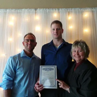 Happy couple with Officiant, Nancy Kerr, on their wedding day in Independence, MO!