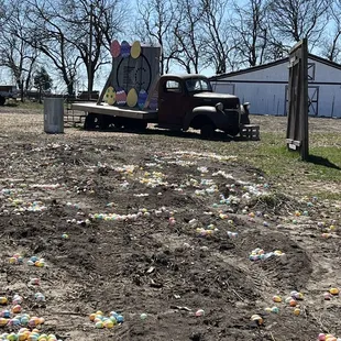 Easter eggs scattered in the dirt for hunting