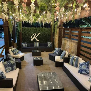 Outdoor Vaping/smoking area.  There is even a Selena Portrait painting outside. Reminds me of SanAntonio river walks.