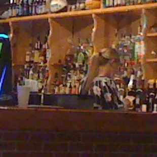 a bartender behind the bar