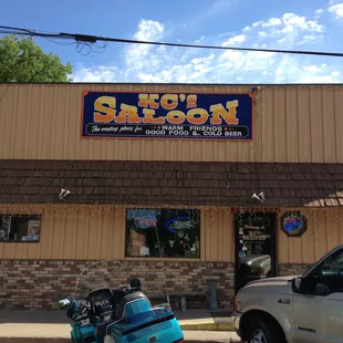 a motorcycle parked in front of the restaurant