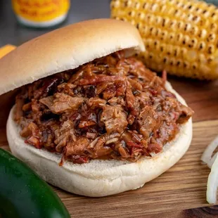 ows a pulled pork sandwich on a bun