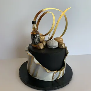  a black and gold birthday cake
