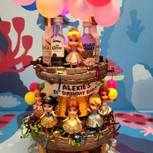  a birthday cake with balloons