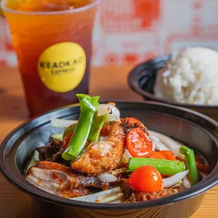 a bowl of food and a drink