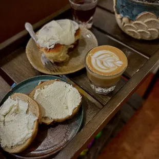 Homemade bagels, cinnamon roll, and cortado