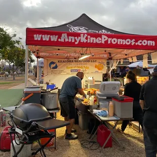 a group of people at a food stand