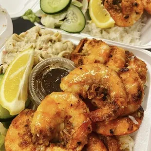 a plate of shrimp and rice