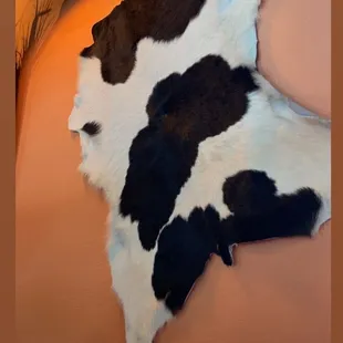 a cow skin on the wall