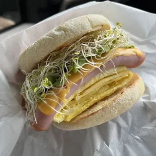 Ham Sunrise Delight on an English muffin +avocado &amp; sprouts $8.10 including tax.