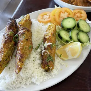 Chicken kebabs, and rice