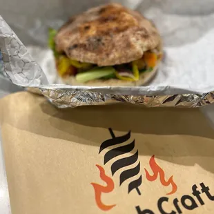 a sandwich wrapped in foil