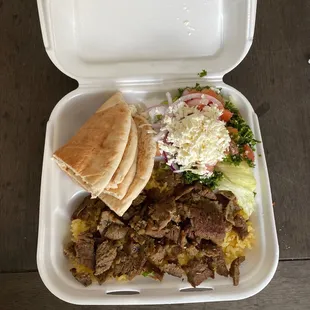 a meal in a styrofoam container