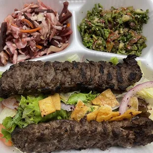 a variety of foods in a styrofoam container