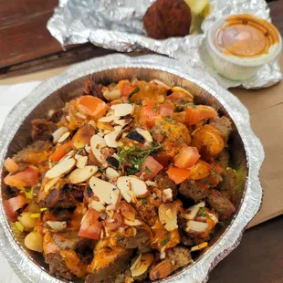 Beef and Lamb Kebab Bowl with Sriracha and Spicy Red Sauces and a side of Falafel!