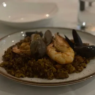 a plate of seafood and rice