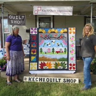 Row by Row winner Wendy (on right) &amp; her beautiful Quilt. Owner Stephanie on the left.