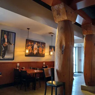 a restaurant with wood columns