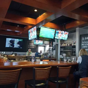 a woman sitting at the bar