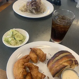Chicken Tender dinner with garlic bread, house slaw, and garlic parmesan dip. Hock and Kraut dinner with potatoes.