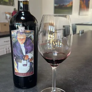 a glass of wine and a bottle of wine