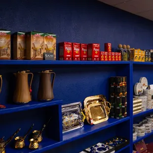 shelves of tea, coffee, and teapots