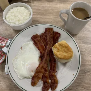 Bacon eggs grits and biscuit.