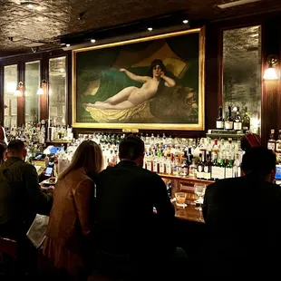 Ms Keen painting above the bar