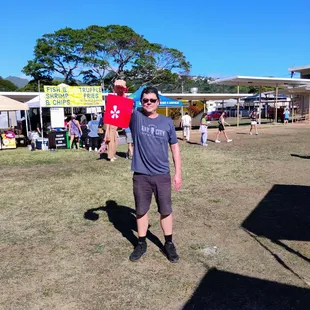 Celebrating Kaimuki. Found the Yelp tent. I ate and drank a lot. Bought some souvenirs. Enjoyed the entertainment. A+!