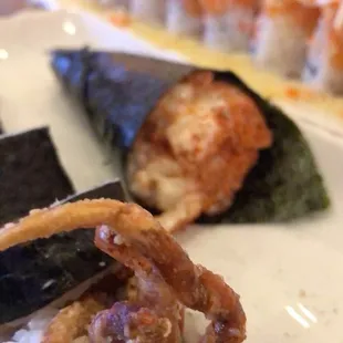Spider roll, chopped scallop hand roll, and angry lion roll.