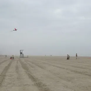 Kite flying near the pier..