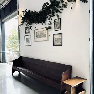 a wooden bench in a large room