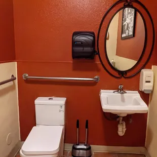 a bathroom with a toilet and sink