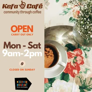 a cup of coffee on a floral tablecloth