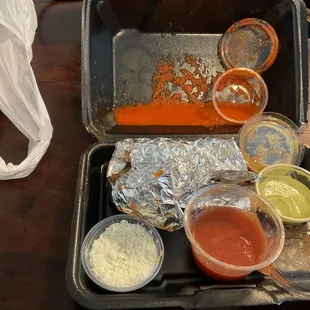 Red salsa spilled on everything, ruiining my dinner. I specifically asked for NOred sauce.