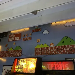 a video game room with arcade machines