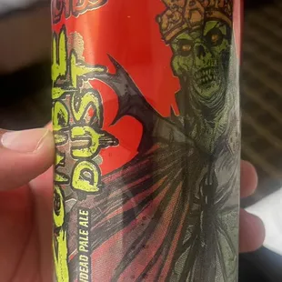 a person holding a can