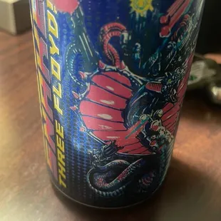 a can of beer on a desk