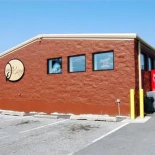 a red brick building with a sign on it