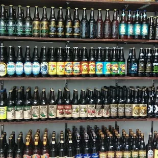 a shelf full of beer bottles