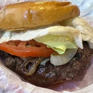 1/2 lb Keg Burger. The other half of the bun is lost somewhere under the massive patty. The grilled onions are a must