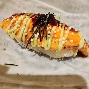 a close up of a piece of sushi